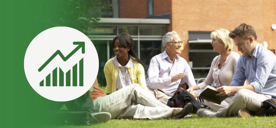 A group of diverse adults sitting on grass outside a modern building, engaged in a relaxed conversation and smiling. On the left side, a white circular graphic shows a green upward arrow on a bar chart, symbolizing growth and development.
