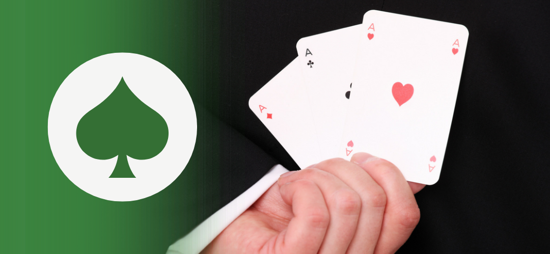 A person in a suit holds a hand of four playing cards—aces of diamonds, clubs, hearts, and spades. On the left, a green overlay features a white circle with a green spade symbol, suggesting strategy, choice, or empowerment in uncertain situations.