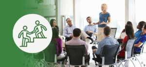 Businesswoman leading a diverse group training session, representing the difference between management training and leadership development in the workplace.