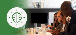 Diverse team collaborating around a conference table, symbolizing cognitive diversity in leadership and how differing perspectives drive innovation and constructive workplace conflict.