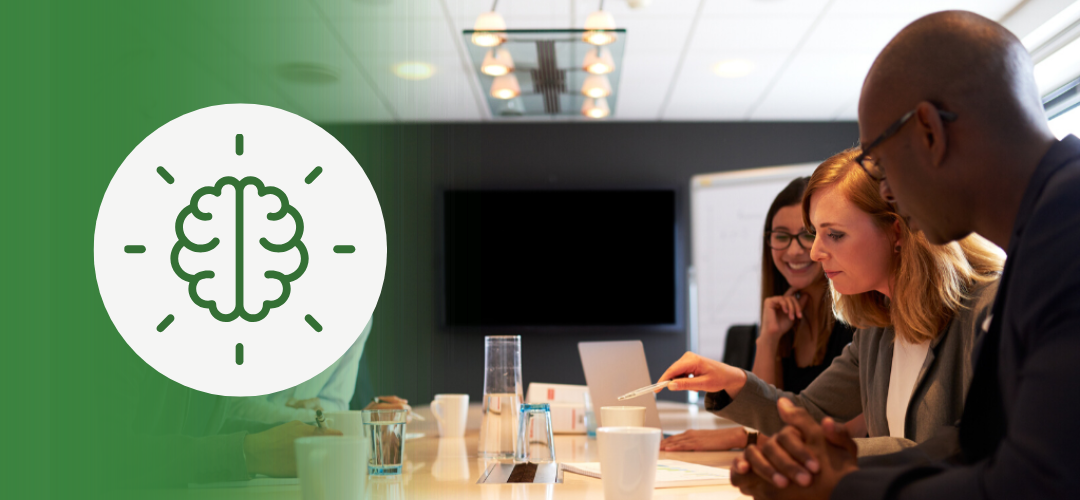 Diverse team collaborating around a conference table, symbolizing cognitive diversity in leadership and how differing perspectives drive innovation and constructive workplace conflict.